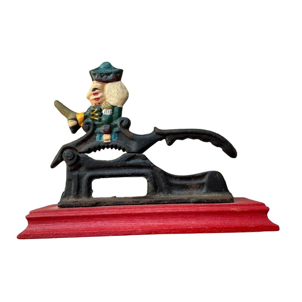 Vintage Cast Iron Figural Nutcracker Red Wooden Base Collectible Kitchen Tool